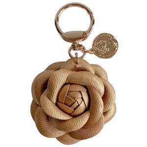 CAMELLIA Flower Gold Leather Goldtone Keychain NWT Comes with Drawstring Pouch